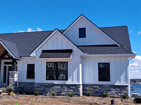 black and white metal house|pictures of white siding houses.